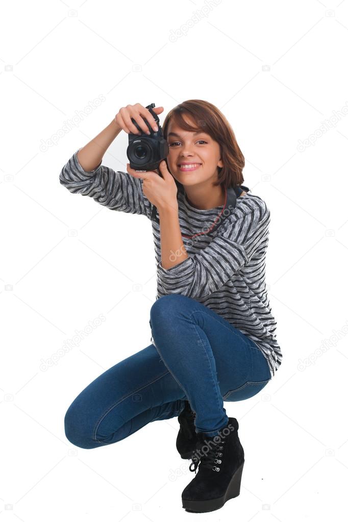 Lovely teenage girl with retro photo camera