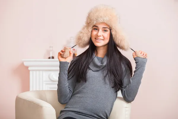 Girl in white fur hat — Stock Photo, Image