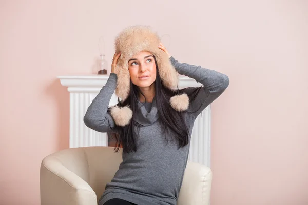 Girl in white fur hat — Stock Photo, Image