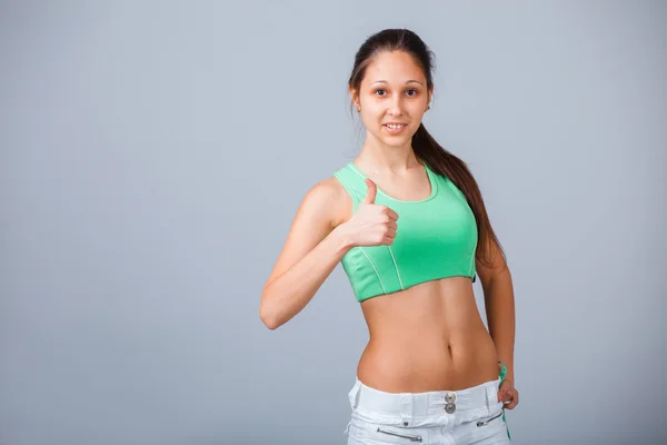 Fitness vrouw duim opdagen — Stockfoto