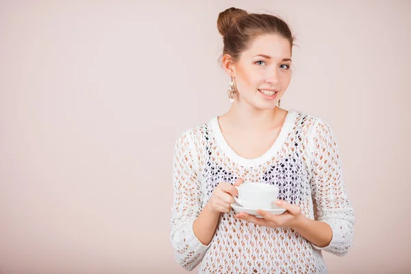 Woman with cup and saucer — Stock Photo, Image