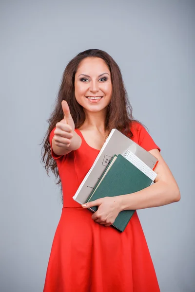 Mädchen mit Ordnern und Büchern — Stockfoto