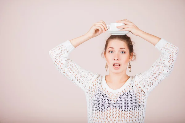 Suprised Woman with cup and saucer — Stock Photo, Image