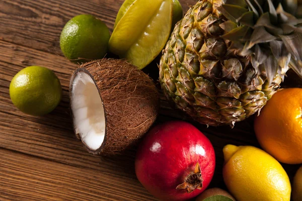 Super tasty tropical fruits on wooden table — Stock Photo, Image