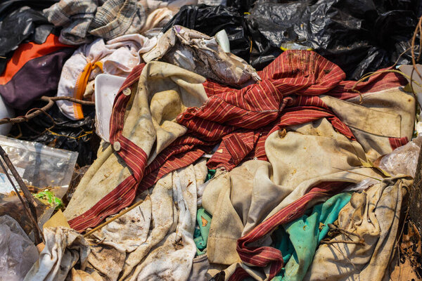 Garbage from fabrics, old clothes that are not biodegradable. abandoned in public Environmental Issues in Developing Countries