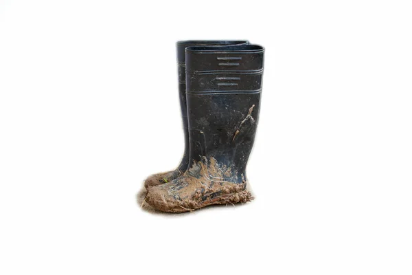 Black Plastic Shoes Brown Sticky Mud White Background — Stok Foto