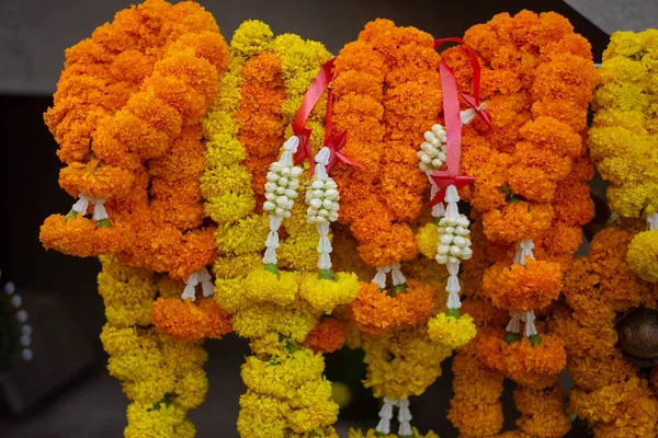 Yellow marigold flower garland for worshiping sacred things according to the beliefs of Brahmins and Hindus.