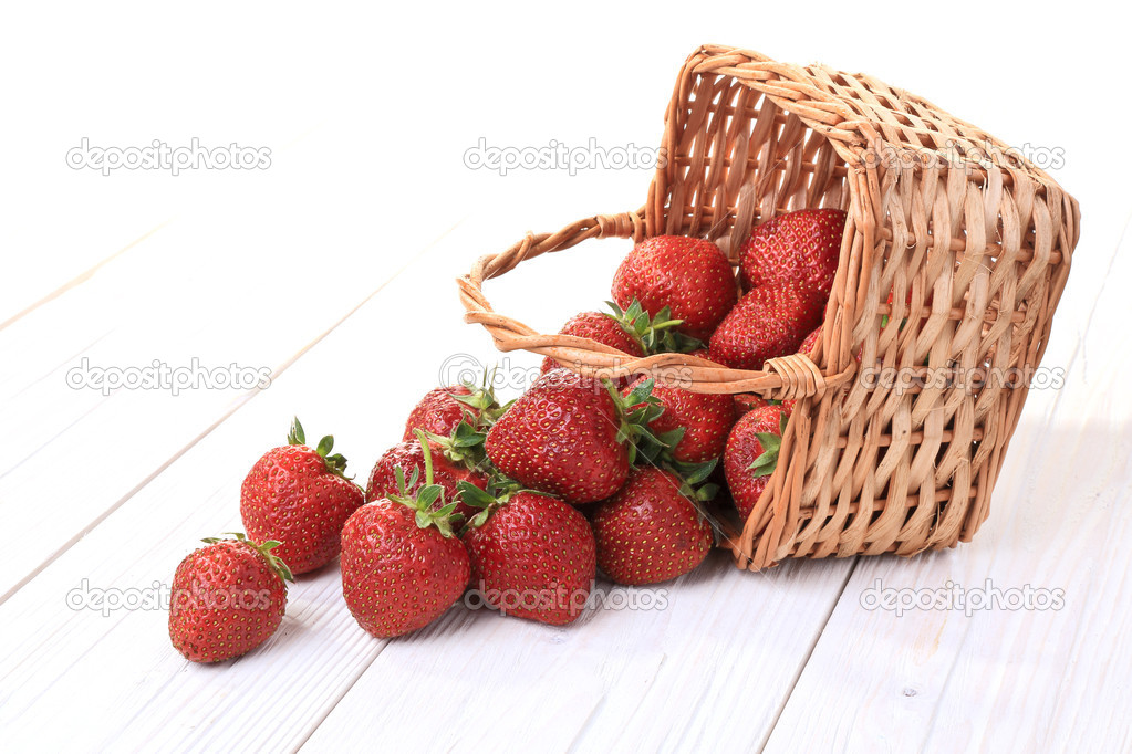 underlying basket of strawberries spilling