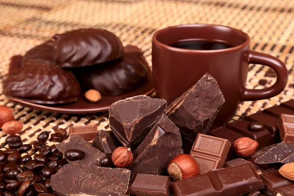 Crushed chocolate on a background coffee cup , selective focus