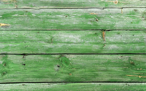 Parede de madeira velha, pintada na cor verde — Fotografia de Stock