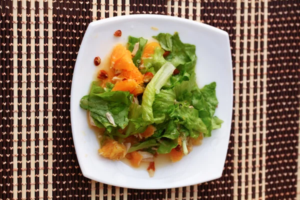 Salad with chicken, oranges, honey and almonds — Stock Photo, Image