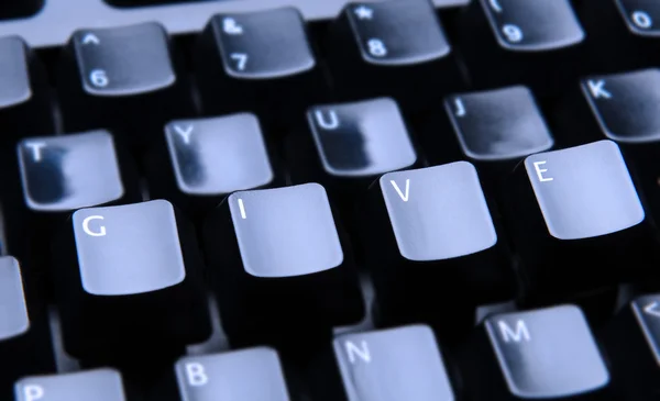 Ge med bokstäver på tangentbordet — Stockfoto