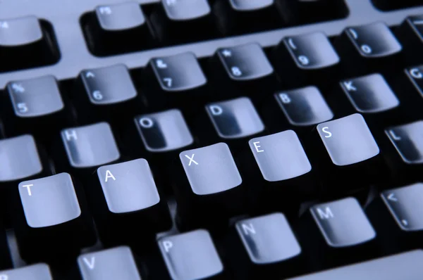 Taxes Spelled Out on Keyboard — Stock Photo, Image
