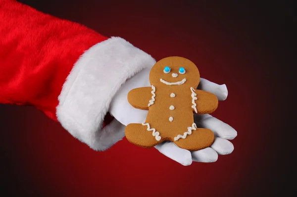 Santa Claus Holding Gingerbread Man in His Hand — Stock Photo, Image