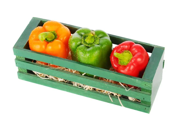 Paprika in houten kist — Stockfoto
