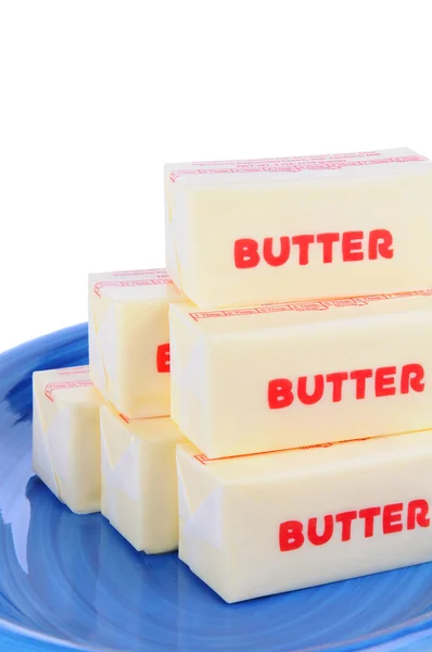 Butter auf blauem Teller — Stockfoto