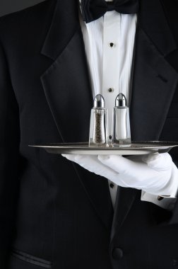 Waiter Holding Tray with Salt and Pepper clipart