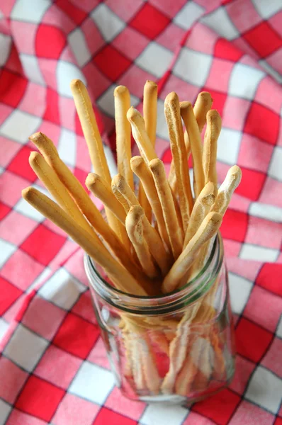 Breadsticks on Checkered Table Cloth — Stock Photo, Image