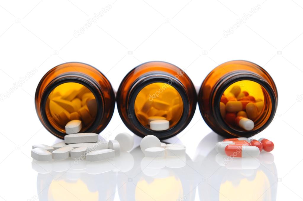 Medicine Bottles with Pills Spilling Out
