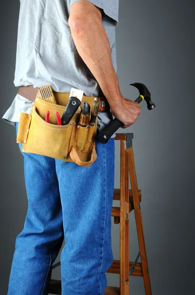 Contractor Standing on Ladder Holding Hammer — Stock Photo, Image