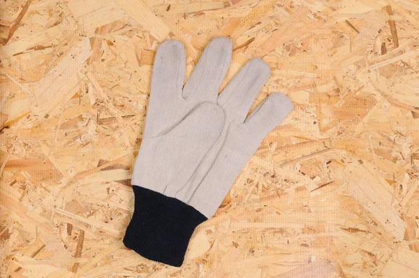 Pracovní rukavice na překližce — Stock fotografie