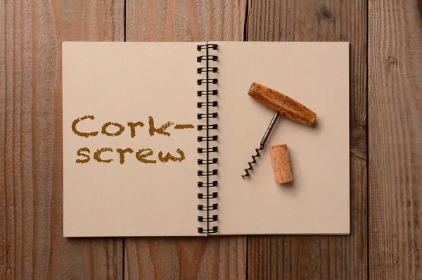 Corkscrew pada Open Notebook — Stok Foto