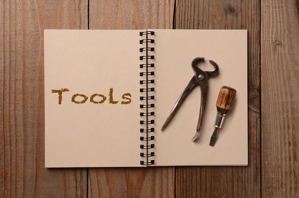 Tools on an Open Notebook — Stock Photo, Image