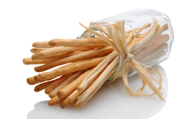 Breadsticks in pot op zijn kant verbonden met raffia — Stockfoto