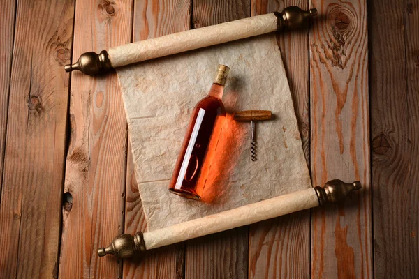 Wine Bottle and Corkscrew on Scroll — Stock Photo, Image