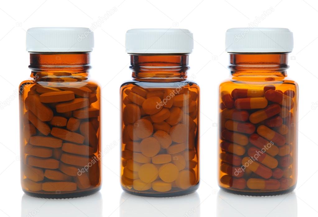 Three Brown Medicine Bottles With Different Drugs