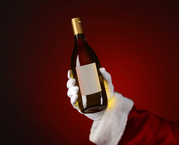 Santa hålla chardonnay vin flaska — Stockfoto