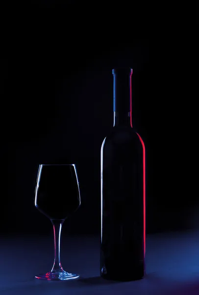 Wine glass and bottle on a background — Stock Photo, Image