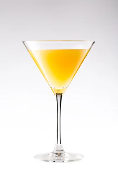 Orange cocktail in a martini glass isolated on white — Stock Photo, Image