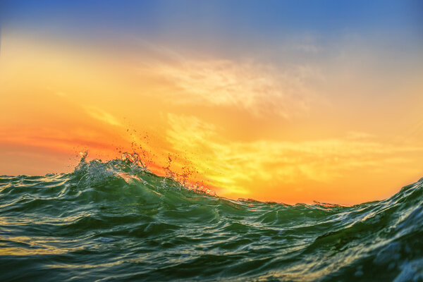 Sunrise and shining waves in ocean