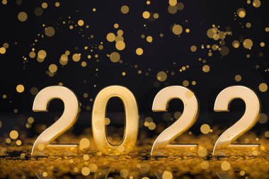 Altın ışıklı arka planlı mutlu yıllar 2022