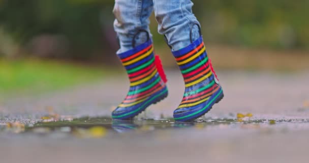 Feet Child Colorful Rubber Boots Jumping Rainy Dirty Puddle Rainy — Stockvideo