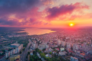 Dramatic sunset over Varna city and Varna lake, aerial view. Bulgaria