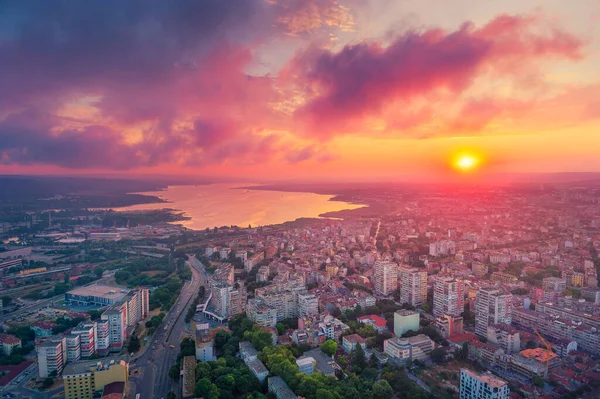Dramatic sunset over Varna city and Varna lake, aerial view. Bulgaria
