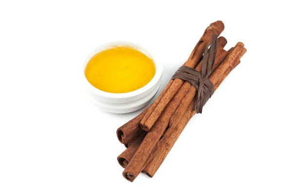 Cinnamon and honey — Stock Photo, Image