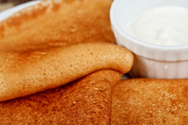 Pancakes with sour cream — Stock Photo, Image