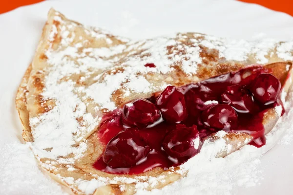 Pancakes with cherries — Stock Photo, Image