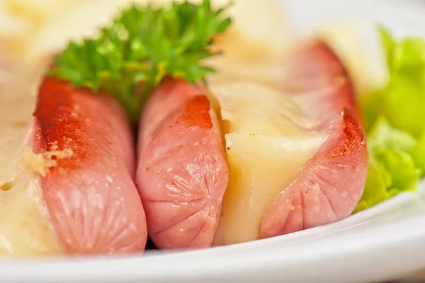 Sausages with cheese and omelette — Stock Photo, Image