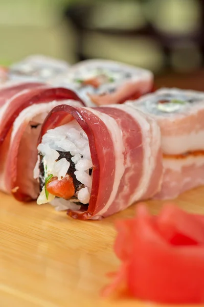 Sushi roll with bacon — Stock Photo, Image