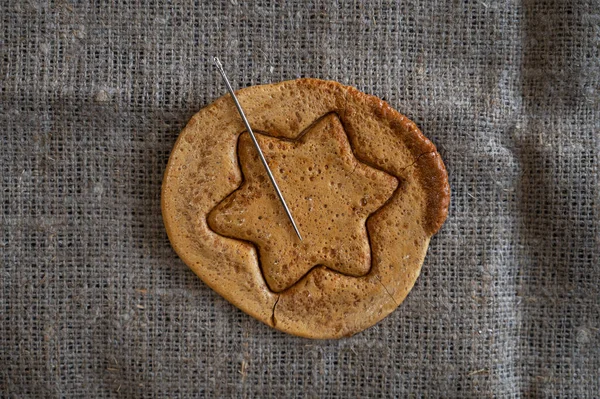 Brown sugar caramel candy cookies with a metal needle — Stock Photo, Image