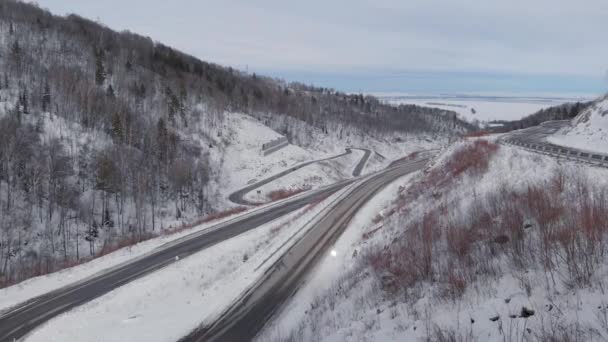 Aerial view of winding road in the mountains — Stock Video