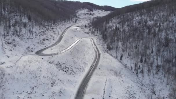 Aerial view of winding road in the mountains — Stock Video