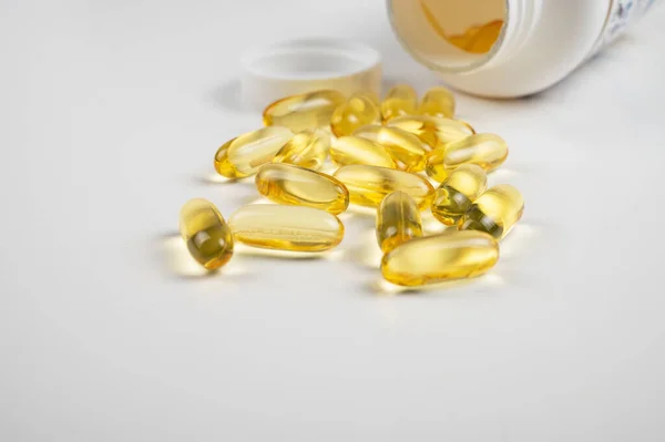 Gold fish oil isolated on white background — Stock Photo, Image