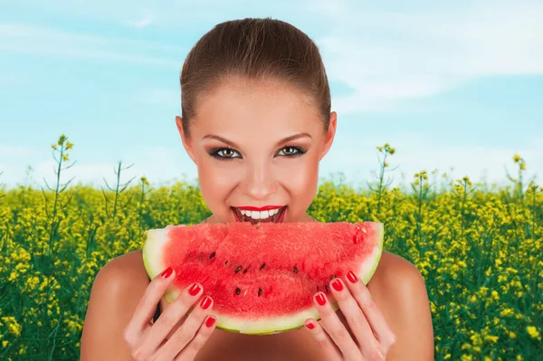 Girl holding slice of watermelon — Stock Photo, Image