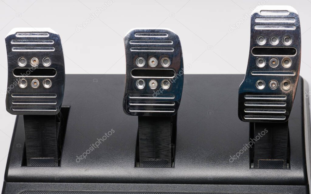 All three car metal shiny pedal isolated close up view
