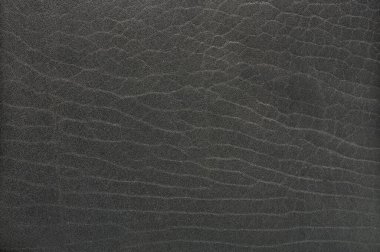 Düz gri deri desen makro yakın görüş. Koyu ten arkaplanı